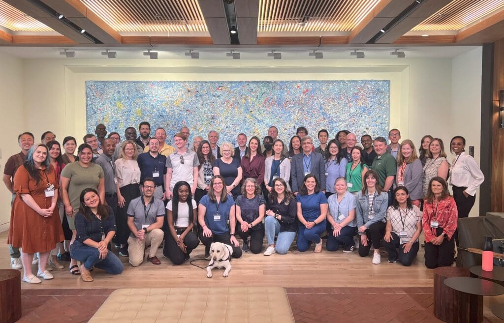 The vision zero academy participants with dog laying in the center.