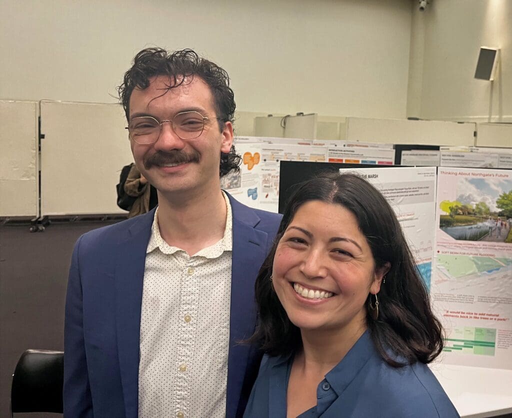 Joe Delorto and Jenn Emiko Kaplan smiling together at MPO presentation.
